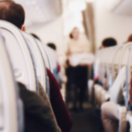 Airplane seats with rows of people