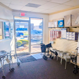 Interior view of the new Binson's Medical Equipment Indianapolis showroom at 9362 Castlegate Drive, featuring a well-stocked display of mobility walkers, knee scooters, bathroom safety supplies, and pediatric plush toys.