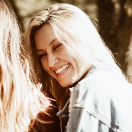 Woman smiling at another woman