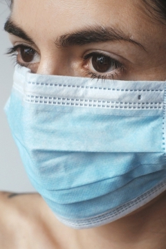 PPE Shopping Section Woman wearing a surgical mask