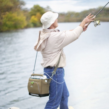 Man fishing on the dock with a portable oxygen concentrator