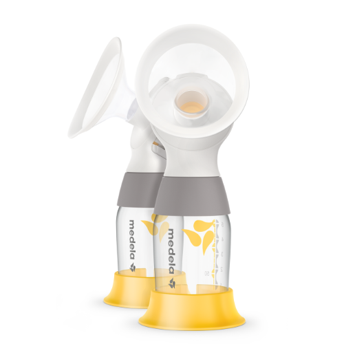 Two Medela PersonalFit Flex™ connectors fully assembled with clear breast shields, milk collection bottles, and yellow stands, featuring an integrated overflow protection design for a comfortable, leak-free pumping experience. Product Image