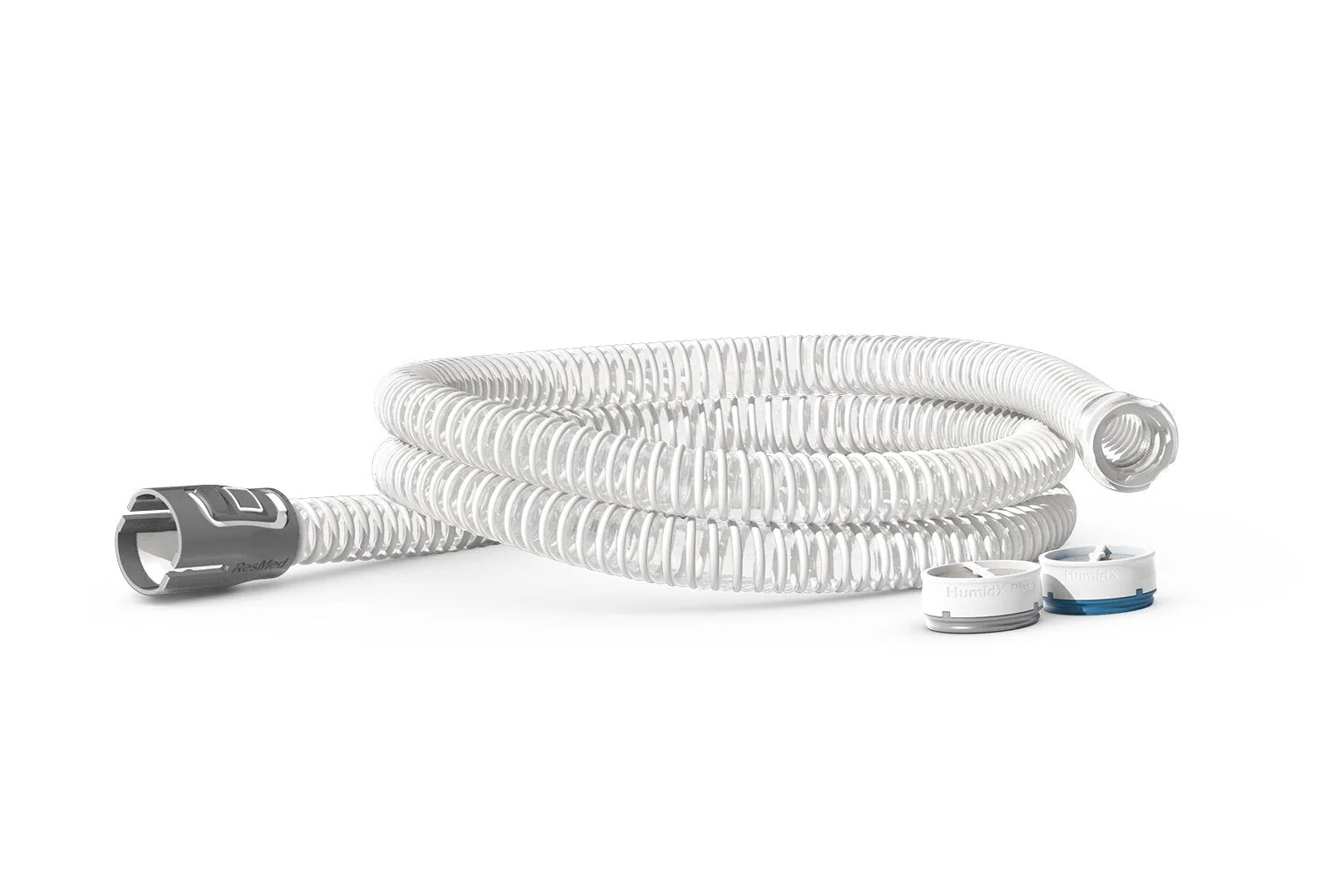 ResMed AirMini CPAP flexible tubing coiled next to HumidX and HumidX Plus waterless humidification cartridges on a white background. Product Image