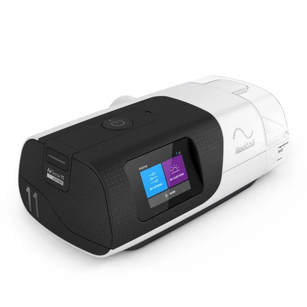 Three-quarter perspective view of the ResMed AirSense 11 AutoSet CPAP machine featuring a digital color touchscreen. Product Image