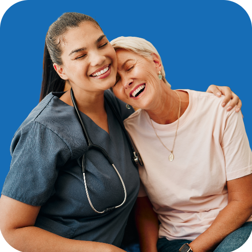 Nurse smiling and hugging a patient