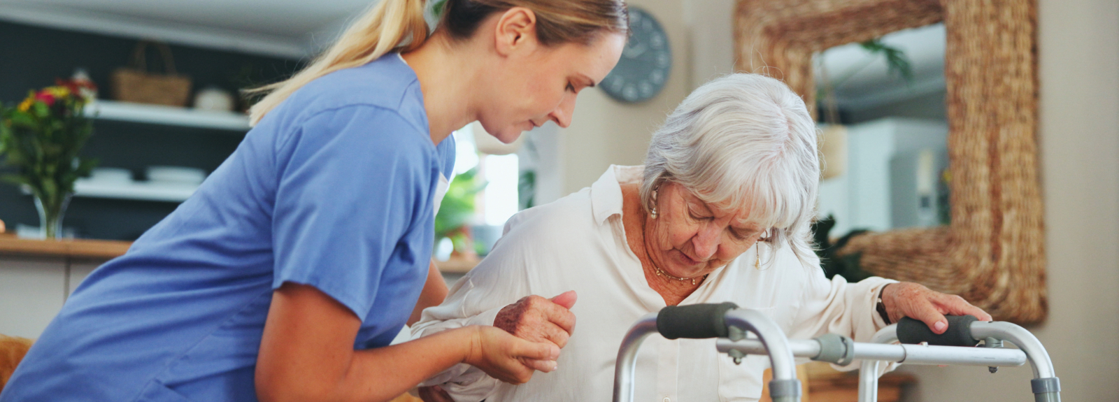 Nurse helping a patient in home, with a walker