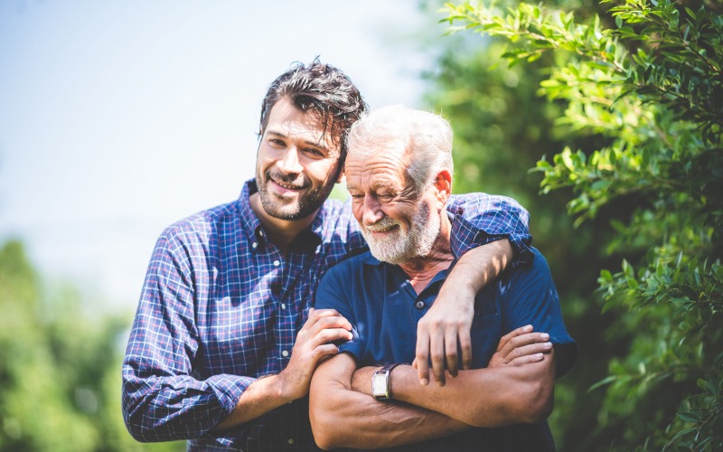 Man and father walking outside