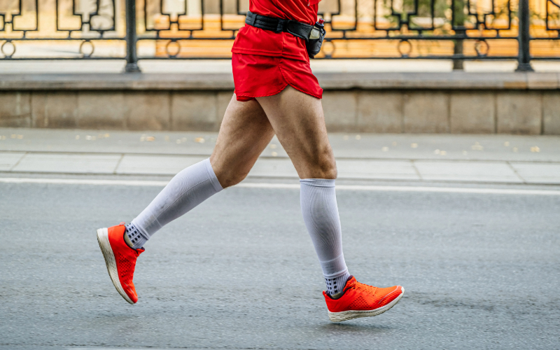 Person running with compression socks on