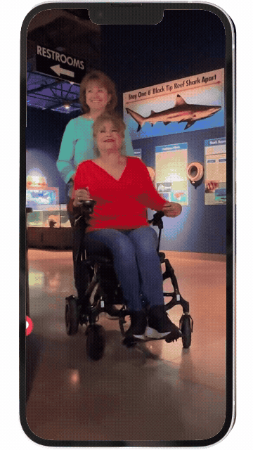 Person operating a power wheelchair clip