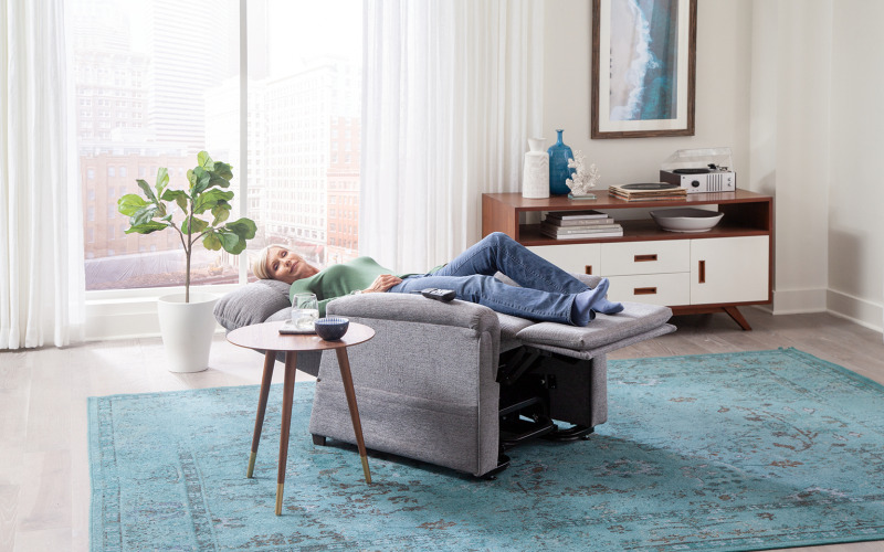 Woman laying in a Golden Tech PR535 lift chair with legs above the heart