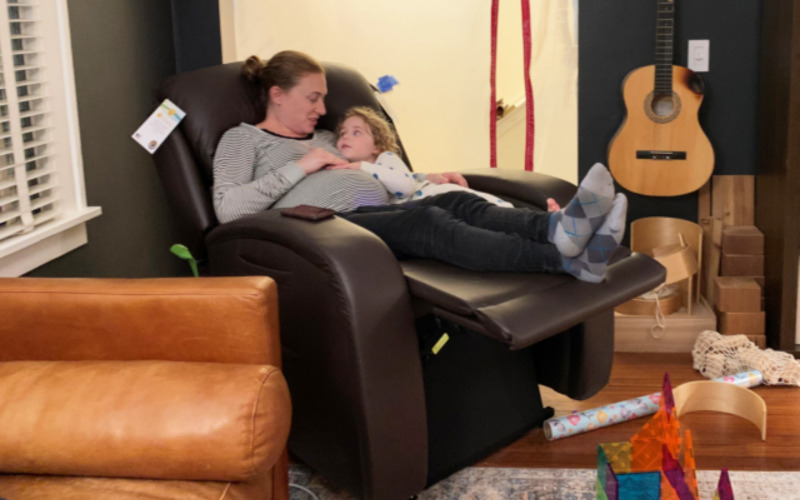 Pregnant mother and child sitting in Golden Tech lift chair