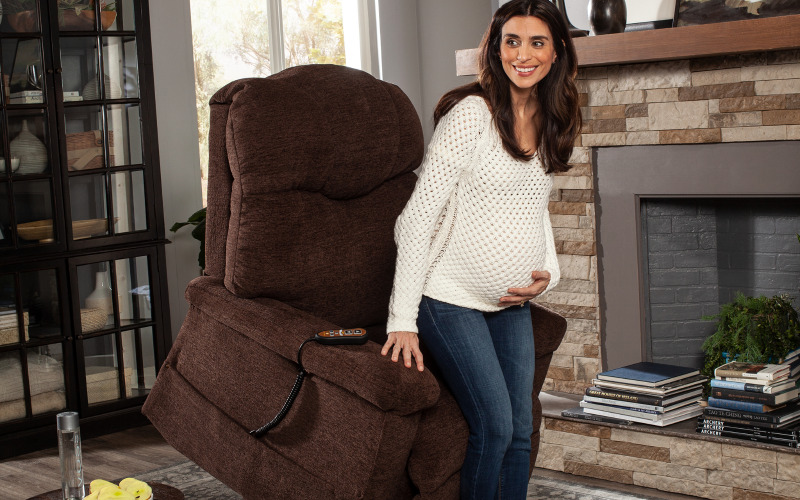 Pregnant woman standing in Golden Tech lift chair