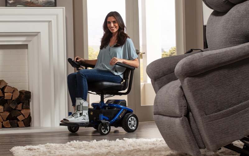 Woman sitting in Golden Tech LiteRider Envy Power Wheelchair